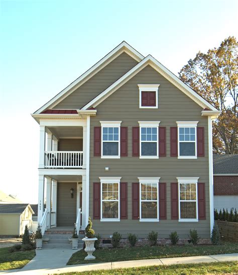 taupe siding house with metal roofs|taupe color siding.